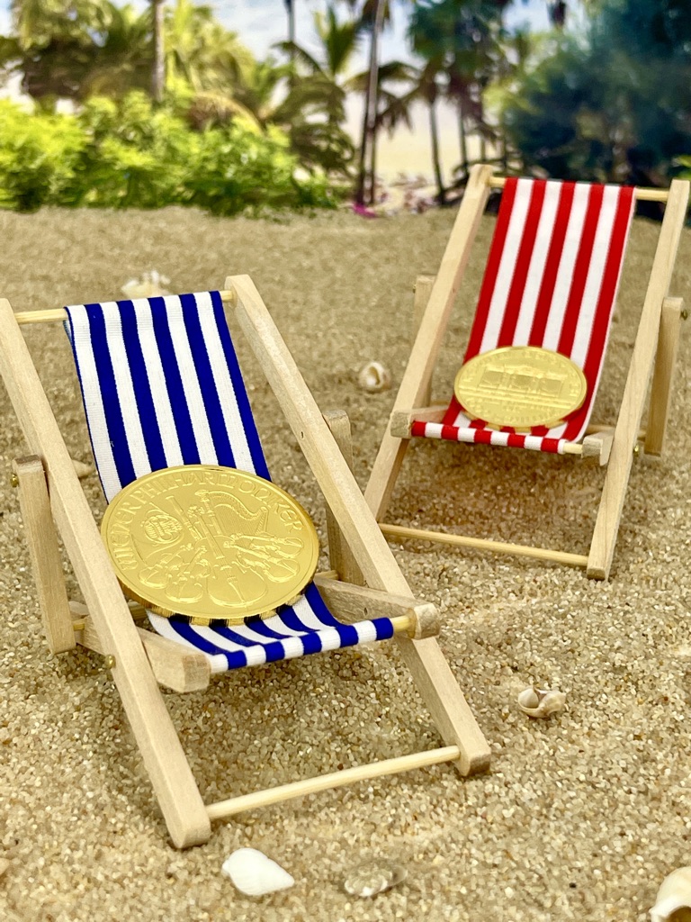 Goldmünzen zum Reise finanzieren Goldmünzen im Liegestuhl fürs Reise finanzieren